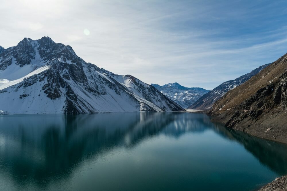 agua de los Andes, snow-covered mountain near body of water